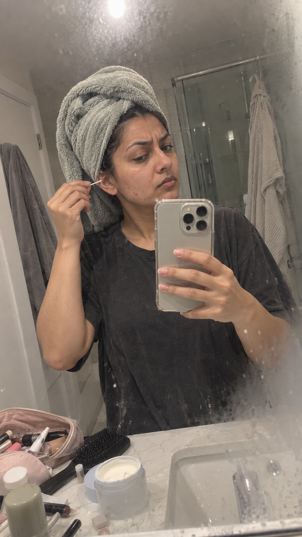 Mirror selfie after a shower, cleaning the outer ear