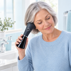 Woman resting the soft cup of the ear washer around her ear